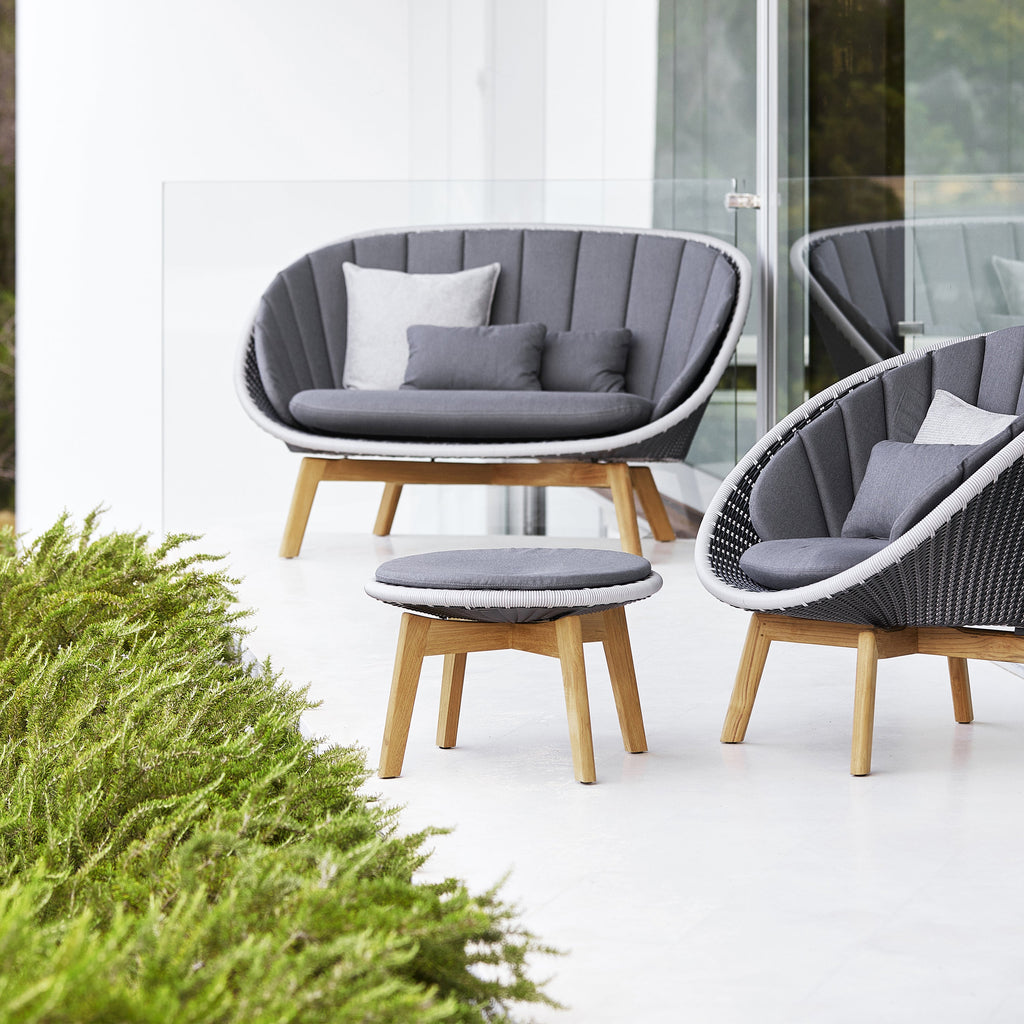 https://cdn.shopify.com/s/files/1/0265/0083/products/cane-line-peacock-outdoor-footstool-side-table-view-add01.jpg?v=1681990416