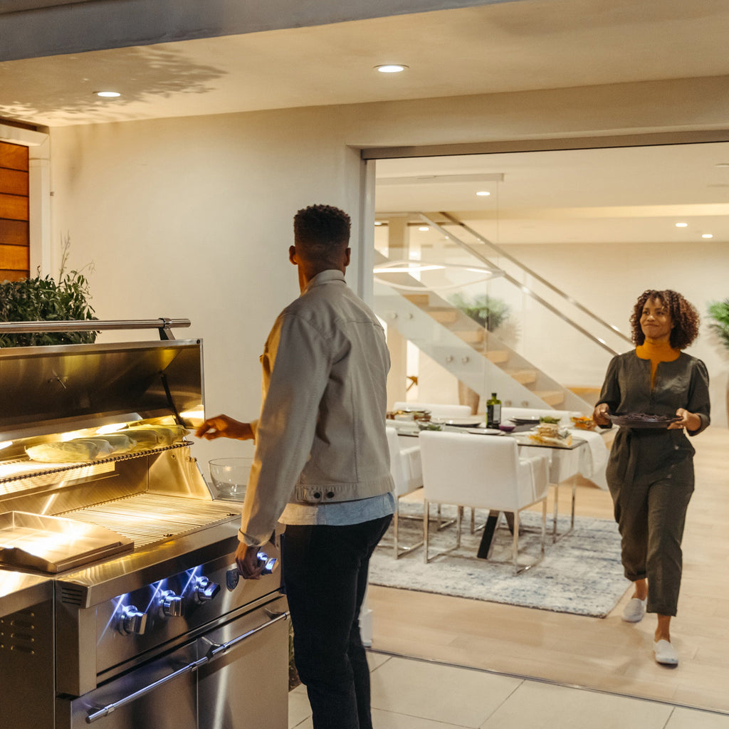 https://cdn.shopify.com/s/files/1/0338/9934/8108/products/freestanding-estate-gas-grill-outdoor-couple-lifestyle_ad9ae105-f185-4217-8df7-c7c7d80939ca.jpg?v=1745980941